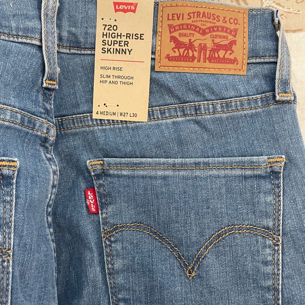 720 high rise super skinny light wash jeans.